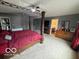 Inviting main bedroom featuring a four-poster bed, neutral carpeting, and large dresser at 1711 Jaques Dr, Lebanon, IN 46052