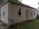Showing the side of the house, a yard, and windows at 1741 N Riley Ave, Indianapolis, IN 46218