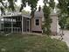 Cozy home featuring a screened-in porch and a quaint backyard at 1741 N Riley Ave, Indianapolis, IN 46218