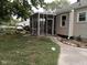 Tan house with a screened-in porch and nice curb appeal at 1741 N Riley Ave, Indianapolis, IN 46218