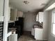 Kitchen with black appliances and cabinets at 1741 N Riley Ave, Indianapolis, IN 46218