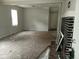 A spacious living room with a fireplace offers comfort at 1741 N Riley Ave, Indianapolis, IN 46218