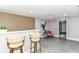 Finished basement features a bar, seating area, light gray paint and wood accent wall at 1820 Hemlock Ln, Plainfield, IN 46168