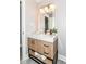 Updated bathroom featuring wood vanity, square mirror with lighting, and tile floors at 1820 Hemlock Ln, Plainfield, IN 46168