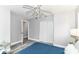 Bedroom with sliding closet doors, ceiling fan, and doorway leading to another room at 1820 Hemlock Ln, Plainfield, IN 46168