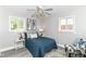 Cozy bedroom with a ceiling fan and two windows providing plenty of natural light at 1820 Hemlock Ln, Plainfield, IN 46168