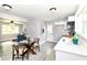 Bright kitchen with modern white cabinets, stainless steel appliances, and an adjacent living room view at 1820 Hemlock Ln, Plainfield, IN 46168