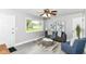 Bright and airy living room featuring stylish decor, gray walls, comfortable seating, and great natural light at 1820 Hemlock Ln, Plainfield, IN 46168