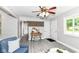 Inviting living room with stylish decor, wood accent wall, a comfortable blue chair, and abundant natural light at 1820 Hemlock Ln, Plainfield, IN 46168
