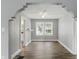 Dining room featuring sleek flooring, bright walls, and arched entry at 1915 Albany St, Beech Grove, IN 46107