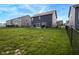 Large backyard with chain link fence offers abundant space between houses for recreation and relaxation at 1981 Turning Leaf Dr, Franklin, IN 46131
