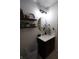 Modern bathroom featuring floating shelves decorated with plants and decorative items at 1981 Turning Leaf Dr, Franklin, IN 46131
