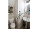 Charming half bathroom featuring a pedestal sink and modern fixtures at 1981 Turning Leaf Dr, Franklin, IN 46131
