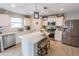 Modern kitchen with white cabinets, stainless steel appliances, and center island at 1981 Turning Leaf Dr, Franklin, IN 46131
