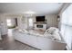 Bright living room featuring a cozy fireplace, large sectional, and neutral decor at 1981 Turning Leaf Dr, Franklin, IN 46131