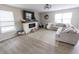 Cozy living room with fireplace and large windows letting in natural light at 1981 Turning Leaf Dr, Franklin, IN 46131