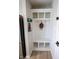 Bright mudroom boasts built-in storage, including shelving, hooks, and bench seating at 1981 Turning Leaf Dr, Franklin, IN 46131