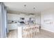 Bright modern kitchen features white cabinetry, stainless steel appliances, and center island with seating at 2040 White Oak Dr, Shelbyville, IN 46176