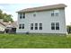 The backyard features manicured landscaping and lots of windows offering natural light at 2303 Eagle Brook Dr, Shelbyville, IN 46176