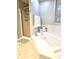 Bright bathroom featuring a soaking tub with tile surround and glass shower at 2303 Eagle Brook Dr, Shelbyville, IN 46176
