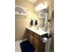 Bathroom with a tree theme design, complete with towel racks and a vanity with storage at 2303 Eagle Brook Dr, Shelbyville, IN 46176