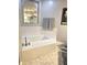 Bright bathroom with a large soaking tub, modern fixtures, and an arched mirror at 2303 Eagle Brook Dr, Shelbyville, IN 46176