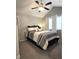 Bright bedroom with a vaulted ceiling, a ceiling fan, and large windows at 2303 Eagle Brook Dr, Shelbyville, IN 46176