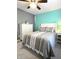 Cozy bedroom featuring a bed with decorative pillows and a stylish white dresser at 2303 Eagle Brook Dr, Shelbyville, IN 46176