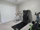 Bedroom featuring a treadmill and bike and a double door closet at 2303 Eagle Brook Dr, Shelbyville, IN 46176