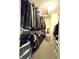 Walk-in closet with ample hanging space and storage, featuring a wide variety of clothing at 2303 Eagle Brook Dr, Shelbyville, IN 46176