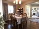 Dining room includes a fireplace, natural light, and seating for six at 2303 Eagle Brook Dr, Shelbyville, IN 46176