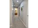 Hallway featuring neutral walls, carpet, and a view of the bathroom at 2303 Eagle Brook Dr, Shelbyville, IN 46176