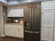 Kitchen with granite countertops, stainless steel refrigerator, and matching cabinetry at 2303 Eagle Brook Dr, Shelbyville, IN 46176
