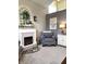 Inviting living room features a fireplace, comfortable seating, and stylish decor at 2303 Eagle Brook Dr, Shelbyville, IN 46176