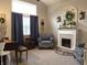 Comfortable living room with fireplace, large windows, and stylish decor at 2303 Eagle Brook Dr, Shelbyville, IN 46176