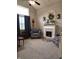 Comfortable living room with fireplace, large windows, and stylish decor at 2303 Eagle Brook Dr, Shelbyville, IN 46176