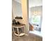 Well-lit staircase with wooden railing and a view of the foyer and window at 2303 Eagle Brook Dr, Shelbyville, IN 46176