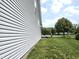 Spacious yard with lush green grass, mature trees and flowering bushes at 2303 Eagle Brook Dr, Shelbyville, IN 46176