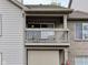 Private condo balcony with wood railing, offering a relaxing outdoor space at 248 Legends Creek Pl # 207, Indianapolis, IN 46229