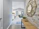 Hallway featuring unique wall decor and sightlines into an open living area at 248 Legends Creek Pl # 207, Indianapolis, IN 46229