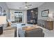 Cozy living room with a fireplace, neutral colors, and a sliding glass door to a balcony at 248 Legends Creek Pl # 207, Indianapolis, IN 46229