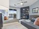 Comfortable living room with a fireplace, balcony, and updated decor at 248 Legends Creek Pl # 207, Indianapolis, IN 46229