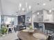 Open concept living room with a fireplace, balcony, and bar seating at 248 Legends Creek Pl # 207, Indianapolis, IN 46229