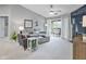 Bright and airy living room featuring neutral tones, comfortable seating, and access to a balcony at 248 Legends Creek Pl # 207, Indianapolis, IN 46229