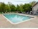 Inviting community pool with chairs and clear blue water at 248 Legends Creek Pl # 207, Indianapolis, IN 46229