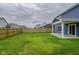 Spacious backyard featuring a manicured lawn and a wooden fence, great for outdoor activities and privacy at 2485 Bristol Dr, Franklin, IN 46131