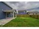 Green backyard with a covered patio, perfect for enjoying the outdoors at 2485 Bristol Dr, Franklin, IN 46131