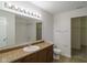 Bathroom with large mirror, extensive vanity, and a toilet next to a doorway at 2485 Bristol Dr, Franklin, IN 46131