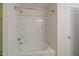 Clean, white bathroom with bathtub/shower combo and tiled walls at 2485 Bristol Dr, Franklin, IN 46131