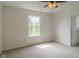 Bright bedroom featuring neutral walls, carpet, a window and a ceiling fan with light fixture at 2485 Bristol Dr, Franklin, IN 46131